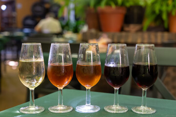 Flight of five sherry wine from barrels, fino, manzanilla, olorosso, amontillado, pedro ximenez jerez wines in old tavern, wine tasting, Sanlucar de Barrameda, Cadiz, Andalusia, Spain