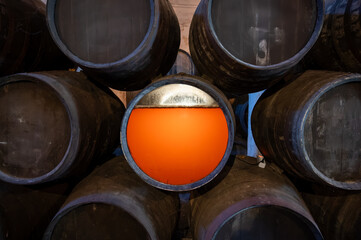 Flor, film of yeast in solera system in old Andalusian wine cellar, process for aging sherry wine in barrels, jerez fortified wine, Sanlucar de Barrameda, Cadiz, Andalusia, Spain