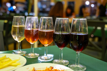 Tasting of sherry wines from barrels, fino, manzanilla, olorosso, amontillado jerez wines with traditional Andalusian tapas in old tavern, Sanlucar de Barrameda, Cadiz, Andalusia, Spain