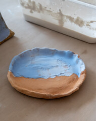 Samples of ceramic art objects and tabelware during workshop in art ceramic atelier in Poland