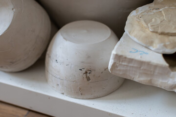 Samples of ceramic art objects and tabelware during workshop in art ceramic atelier in Poland