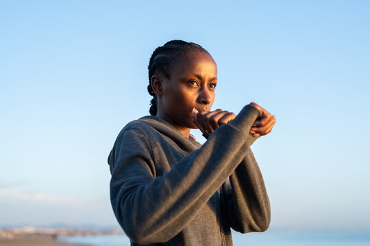 Woman in defensive boxing stance - Powered by Adobe