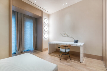 Exclusive bedroom interior design. Windows with Roman curtains, stylish lamps, designer .furniture.
