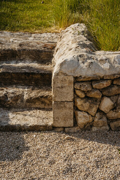 Close-up of rustic stone bench outdoors