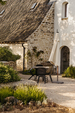 Idyllic rustic garden with outdoor dining set