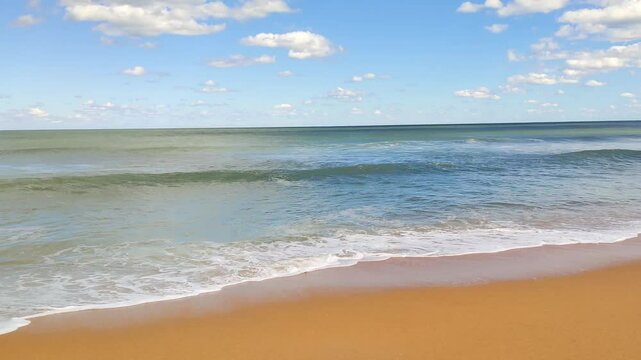 Ocean Waves on the Beach on a Sunny Day