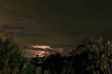 Long exposure of a nocturnal electric storm over the western Andean mountains of central Colombia, captured from a farm in the eastern mountains.