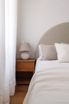 A serene bedroom featuring a neatly made bed