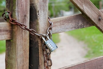 Padlock combination lock with chain on the fence