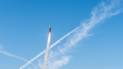 Missile soaring through blue sky with contrail sunlight glinting off sleek shape