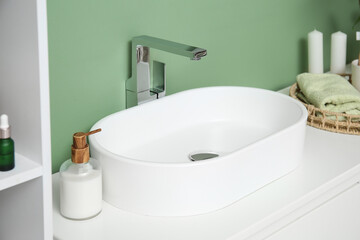 White ceramic sink in bathroom
