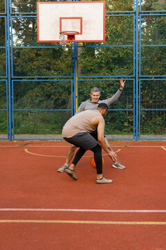 Defender endeavoring to stop opponent from dribbling ball