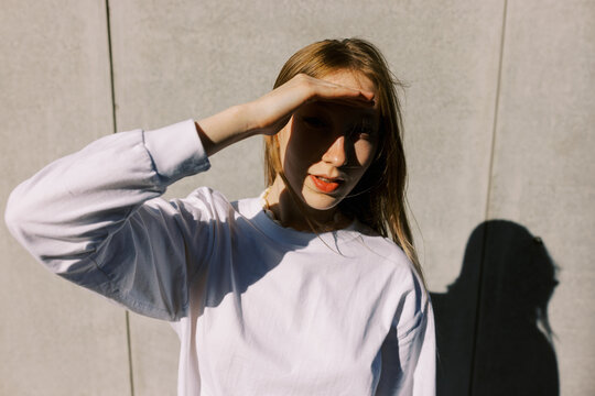 portrait of real young woman with shadow on her face