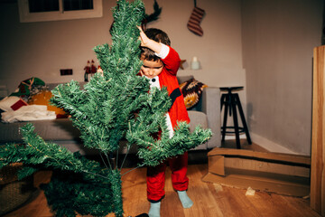 Child Assembling Christmas Tree