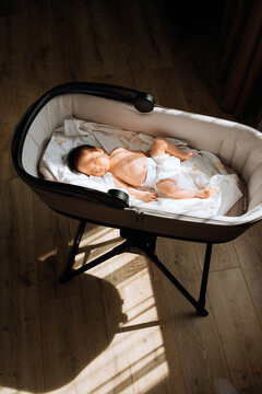 the newborn lies in the sun and gets vitamin D.