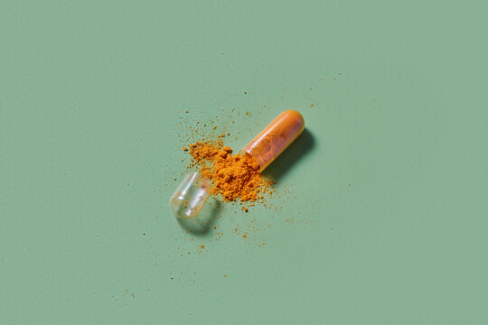 Broken capsule with textured content spilling out in studio