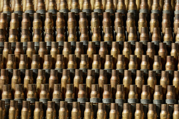 Used machine gun casings placed in multiple layers