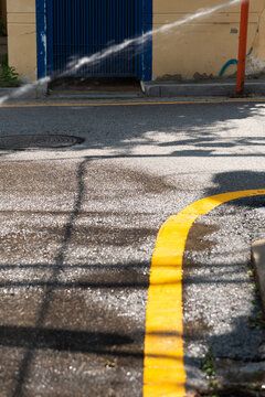 Watering on the street with a hose