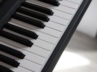 Top view of the piano keyboard. A musical monochrome instrument. Black and white keys of digital piano, organ, grand piano