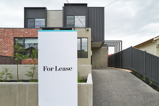 Modern Australian townhouse with For Lease sign
