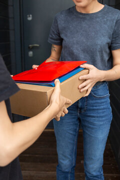 Person Receiving a Package and Envelopes