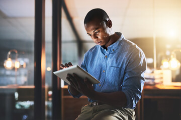 Night, tablet and black man in office for business, connectivity and research for webdesign....
