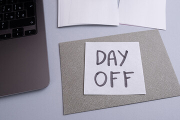Day off - workplace message in the office. Concept of absence from work and day off
