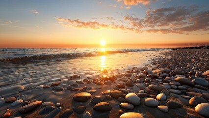 Obraz premium A serene sunset over a pebbled beach, reflecting warm colors on the water's surface.