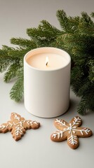 A white candle sits atop a wooden tray alongside a gingerbread cookie and fresh evergreen sprigs, creating a warm and inviting winter atmosphere