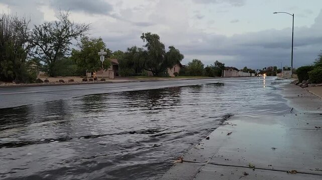 Aftermath of overnight rain fall flooding streets in North-West Phoenix, Arizona