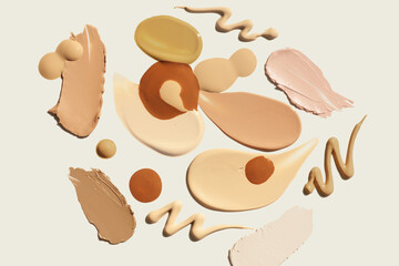 Texture of smudge cosmetic make up bb and  cc cream, foundation, concealer, bronzer set liquid background