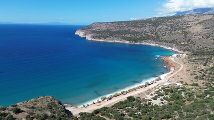 Naklejka premium Beautiful drone picture during a flight near the caves of Pyros Dirou in Greece. The water is just gorgeous and made of a beautiful blue.
