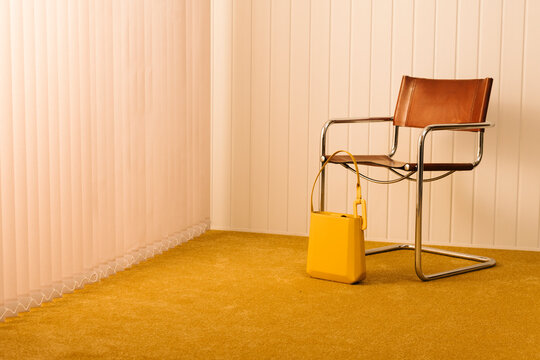 Retro Styled Chair with Yellow Bag in Minimalist Room