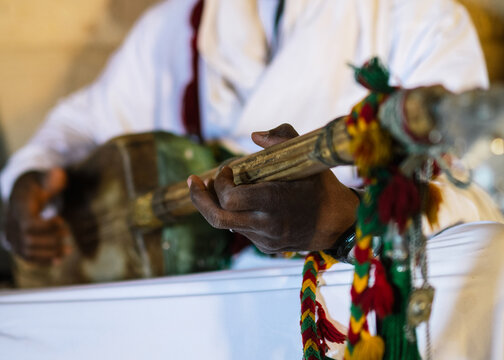 Gnawa musician playing on his instrument
