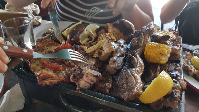 Argentina lifestyle: friends eating asado
