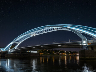 Fototapeta premium City Harbour Bridge at Night Over the River with Reflections of City Lights