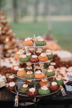 Tiered display of colorful cream-filled pastries