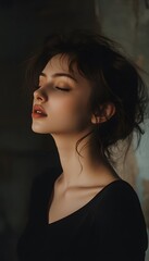 Fototapeta premium A woman in a black top with her hair up