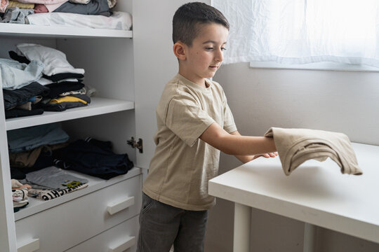 Child Choosing Clothes For School