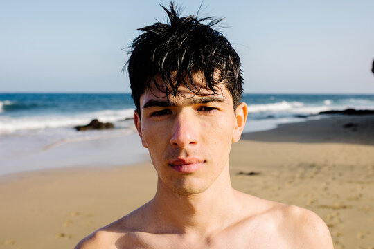 Portrait of a teenager posing with a serious look on Papagayo Beach
