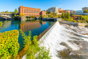 View from the riverside Centennial Trail looking over the Lower Spokane Falls with Riverfront Park, the Monroe St. Bridge and downtown across the river in Spokane, Washington USA.  © Kirk Fisher