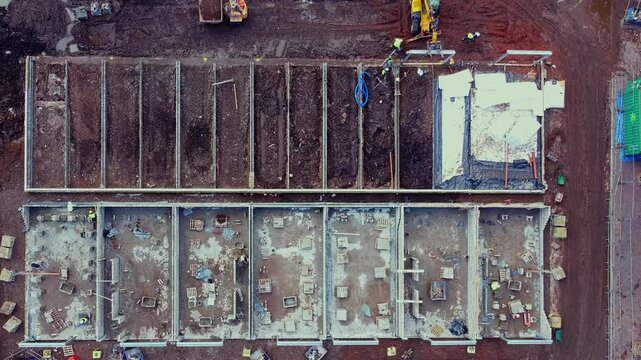Aerial drone futage of construction progress at a new residential site in the heart of the city 