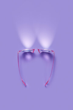 Kaleidoscope googles with pink case projecting light from lenses