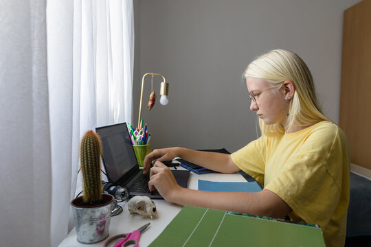 Student is solving a math problem at pc at home