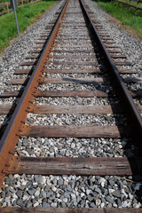 Fototapeta premium Vertical image of railroad tracks used for freight and passengers
