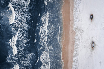 Top down view of snowy beach at winter Baltic Sea.