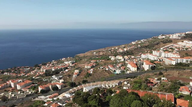 Panoramic view of the city of Canico, Madeira, the expressway and the tunnel on a sunny day, 4k video
