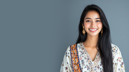 Fototapeta premium Indian woman in traditional batik cloth isolated on gray copy space