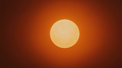 Sun rises through smoke cloud over horizon, pacific ocean in morning, casting warm glow on water.