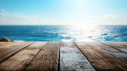 Fototapeta premium 2410 67.A wooden tabletop set against a blurred backdrop of a bright blue sea and clear sky. The tableâ€™s texture contrasts with the distant water, creating an inviting scene for enjoying a seaside